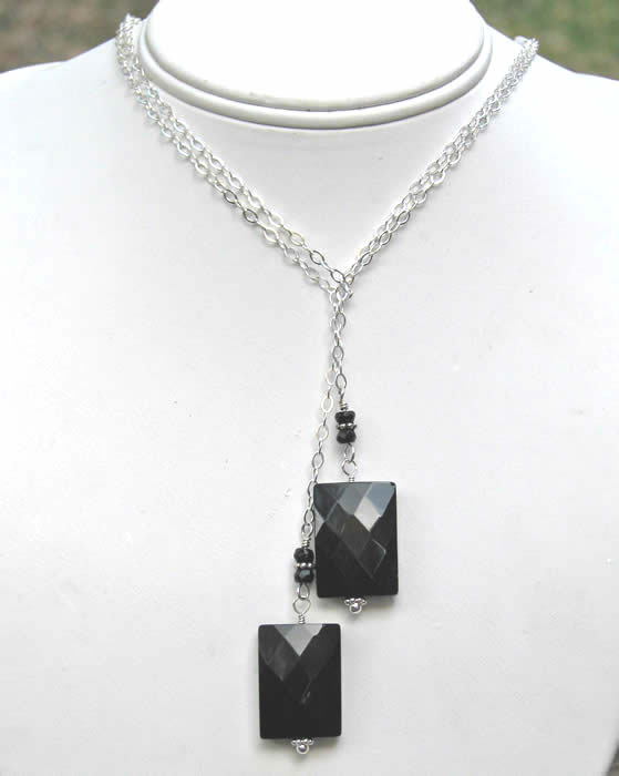 Sterling silver lariat with faceted black onyx rectangle beads and small faceted black onyx rondelle beads