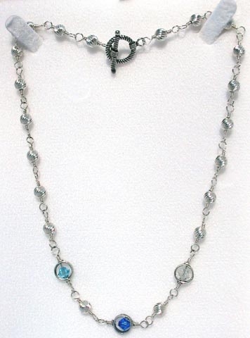 birthstone mother's necklace.  The birth stones of your choice surrounded by sterling silver.