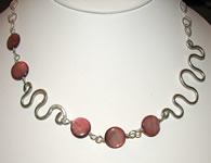 pink shell with silver squiggles necklace
