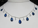 blue kyanite briolettes with tiny white topaz briolettes on a sterling silver figure-eight chain 
