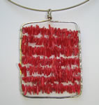 hammered sterling silver pendant with red coral chips