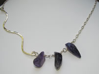asymetrical hammered silver necklace with freeform amethyst beads