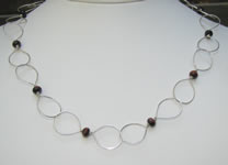 hand made large link necklace with red tiger eye accents