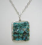 hand forged silver frame pendant with turquoise beads 