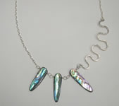 asymetrical sterling silver necklace with long paua shell beads